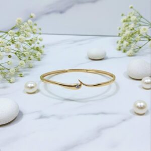 regal mustard gold kundan jhumka earrings with pearl detailing