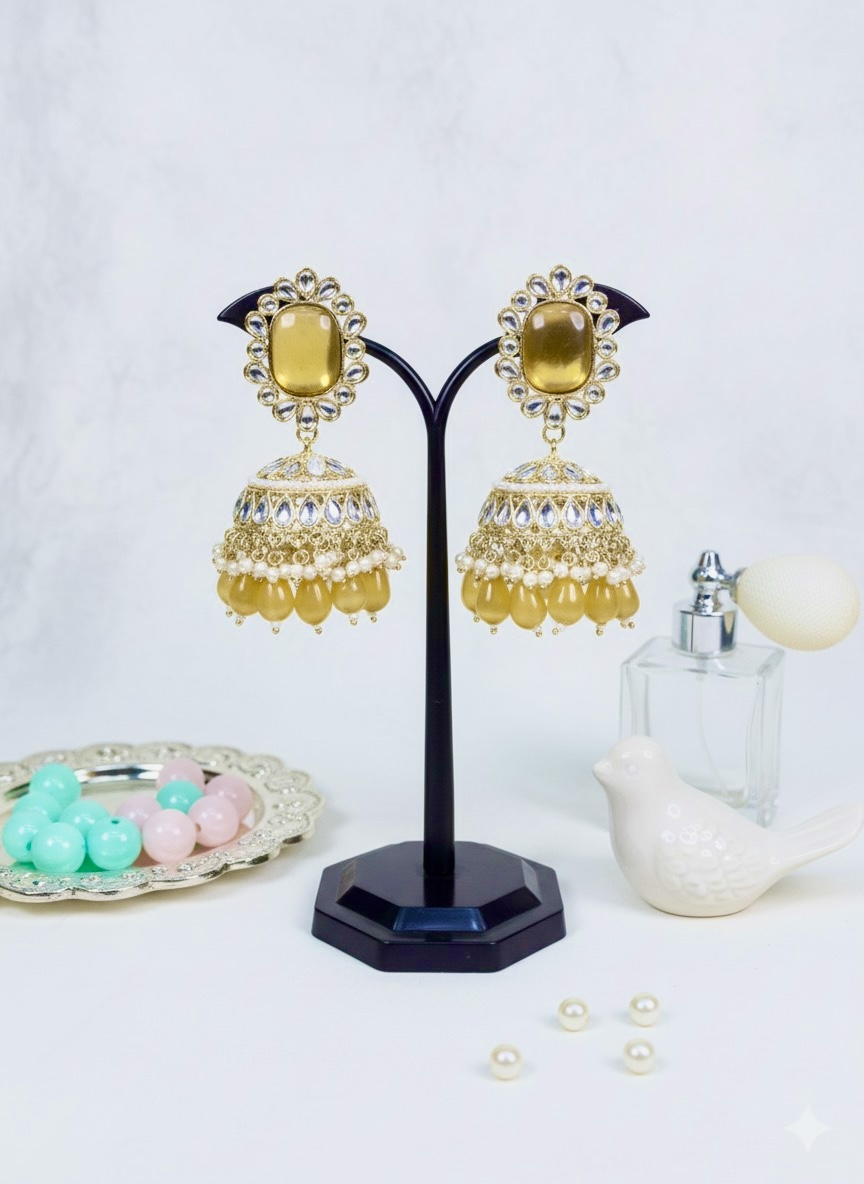 regal mustard gold kundan jhumka earrings with pearl detailing regal mustard gold kundan jhumka earrings with pearl detailing