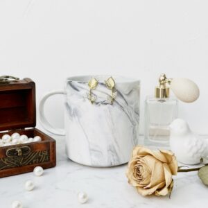 regal mustard gold kundan jhumka earrings with pearl detailing